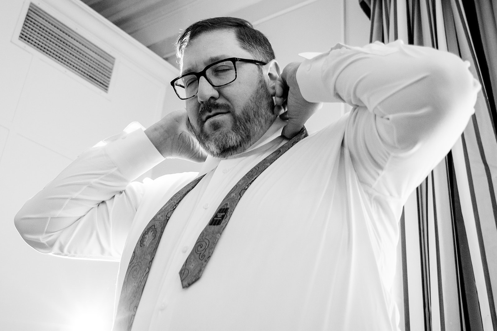 Groom getting ready at Hotel Monaco in Washington DC before the wedding ceremony by Potok's World Photography