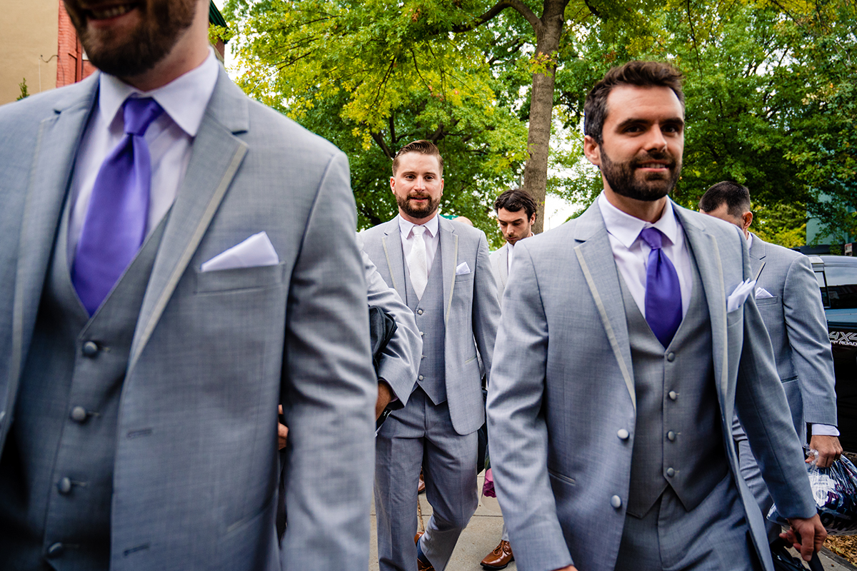 Groom getting ready with his groomsmen before wedding ceremony in Washington DC by Potok's World Photography