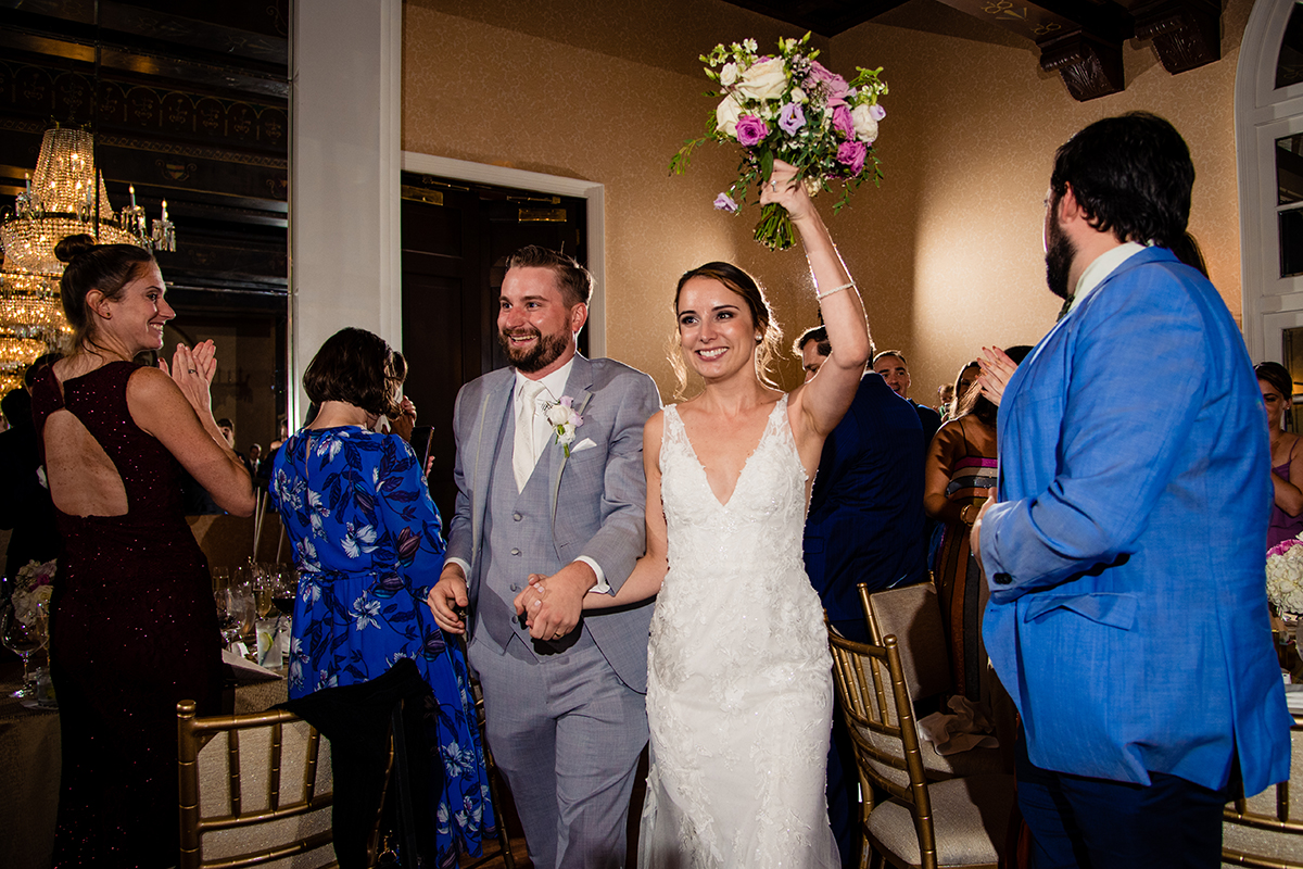 Bride and groom enter the ballroom at the St. Regis in DC for their wedding reception by Potok's World Photography